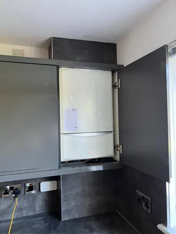 The same kitchen cupboard with a new Alpha boiler fitted